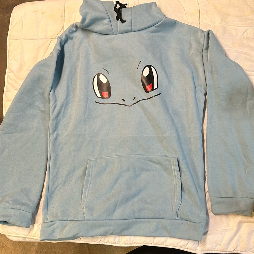 Squirtle pull-over hoodie with pikachu ears on the hood.